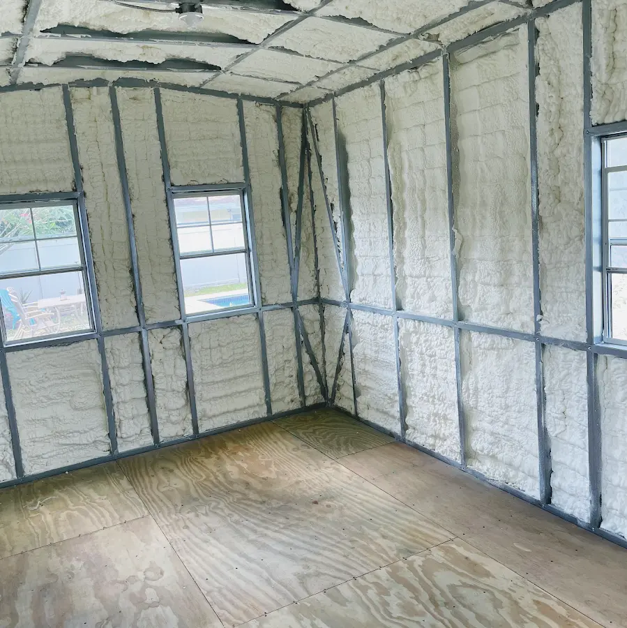 Closed-cell spray foam insulation applied to wall cavities in a residential project in Hilmar-Irwin
